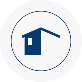 Icon of a house inside a circle.